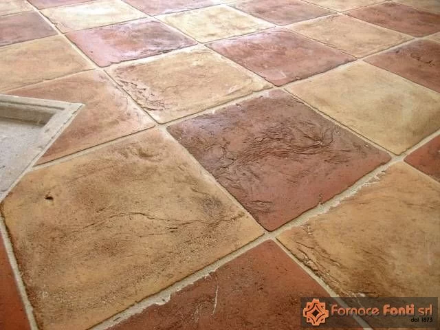Restauro di pavimentazione a scacchiera con tavella rossa e gialla