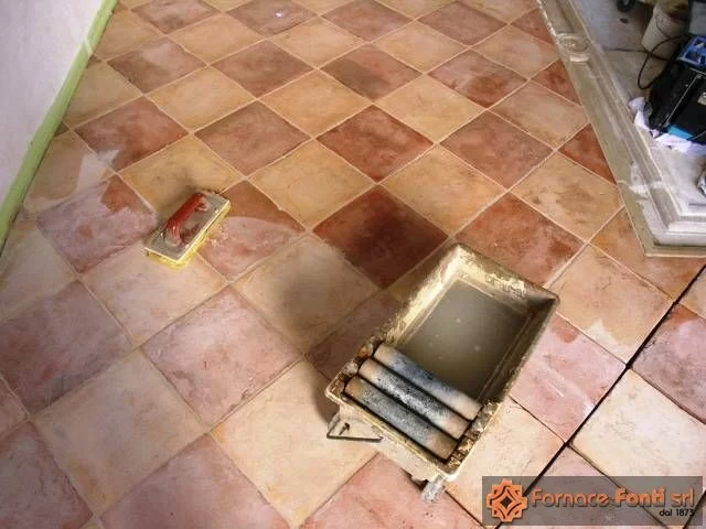 Restauro di pavimentazione a scacchiera con tavella rossa e gialla