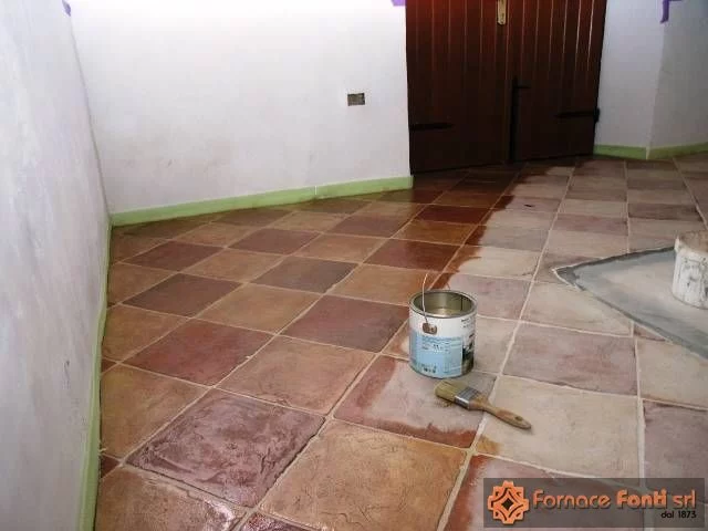 Restauro di pavimentazione a scacchiera con tavella rossa e gialla